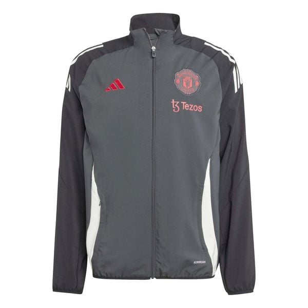 Kamizelka prezentacyjna Manchester United Tiro 2024/25. Niebieskie bluzy Adidas, bez wzorów, bez kaptura. W wyprzedaży za 286.50 zł.