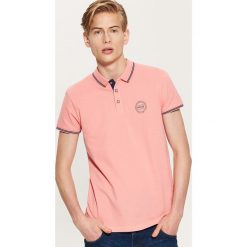 Koszulka polo - Pomarańczo. Koszulki polo sportowe marki House. W wyprzedaży za 29.99 zł.
