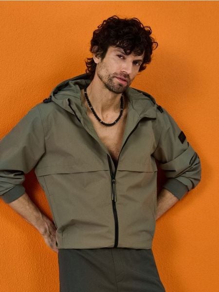 Kurtka techniczna z kapturem i ściągaczami - zielony. Zielone kurtki Sinsay, l, bez wzorów, z kapturem. Za 69.99 zł.