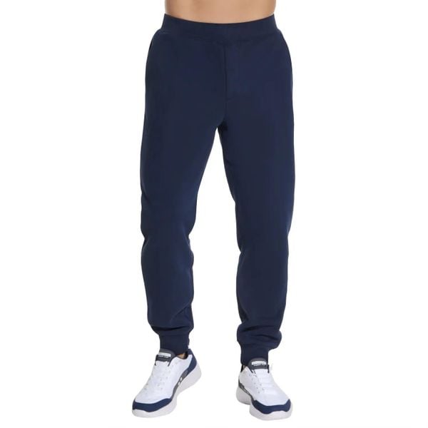 Spodnie sportowe męskie Skech-Knit Ultra Go Weekend Jogger. Niebieskie joggery i bojówki Skechers, m, bez wzorów, z bawełny, sportowe. Za 269.99 zł.