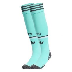 Getry wyjazdowe Niemcy 26. Niebieskie legginsy długie sportowe Adidas, bez wzorów, do piłki nożnej. Za 99.95 zł.