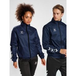 Kurtka ortalionowa piłkarska dla dorosłych Hummel Core XK Spray Jacket. Niebieskie kurtki Hummel, xl, bez wzorów, bez kaptura. Za 212.50 zł.