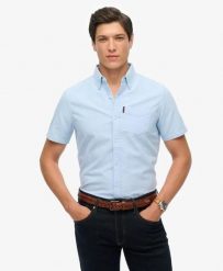 Superdry Oxford Short Sleeve Shirt – koszula Oxford krótki rękaw 100% bawełna. Niebieskie koszule Superdry, s, bez wzorów, z bawełny, bez kołnierzyka, bez ramiączek. Za 279.65 zł.
