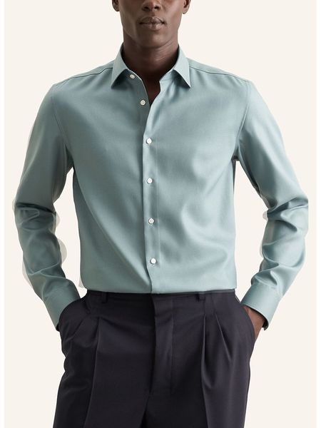 Seidensticker Koszula w kolorze turkusowym rozmiar: 41. Niebieskie koszule Seidensticker, bez wzorów, z bawełny, bez kołnierzyka, bez ramiączek. Za 100.75 zł.