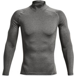 Koszulka z długim rękawem i stójką Under Armour HeatGear®. Czarne odzież kompresyjna Under Armour, bez wzorów, do biegania. Za 196.00 zł.
