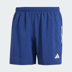 Szorty Own The Run. Niebieskie szorty Adidas, bez wzorów, z materiału, sportowe. Za 179.00 zł.