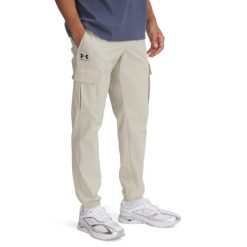 Spodnie Mężczyzna UNDER ARMOUR UA VIBE WOVEN CARGO PANTS. Brązowe spodnie treningowe długie Under Armour, m, bez wzorów. Za 358.95 zł.