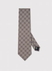 PAKO LORENTE – Beżowy krawat w kwiaty. Brązowe krawaty i muchy Pako Lorente, bez wzorów, z poliesteru. Za 99.99 zł.