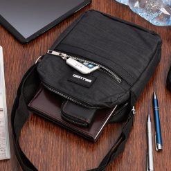 Torba na ramię męska saszetka listonoszka raportówka czarna lekka pojemna GR-7405. Czarne torby na ramię bez wzorów, na ramię, bez dodatków. Za 54.99 zł.