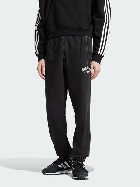 Adidas Spodnie dresowe w kolorze czarnym rozmiar: L. Czarne spodnie treningowe długie Adidas, l, bez wzorów, z bawełny. Za 154.07 zł.