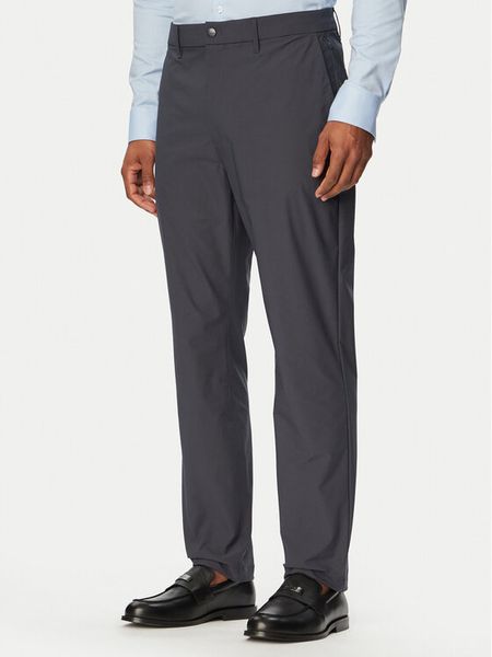 Calvin Klein Spodnie materiałowe LV04LB610G Granatowy Slim Fit. Niebieskie spodnie materiałowe CALVIN KLEIN, m, bez wzorów, z materiału. Za 409.99 zł.