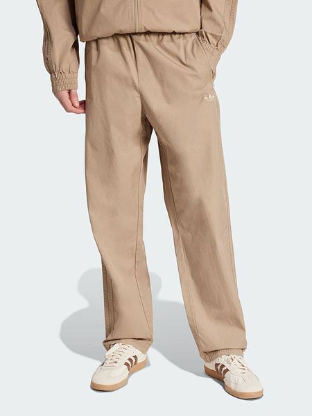 Adidas Spodnie "Originals" w kolorze beżowym rozmiar: XS. Brązowe spodnie materiałowe Adidas, xs, bez wzorów, z materiału. Za 169.95 zł.