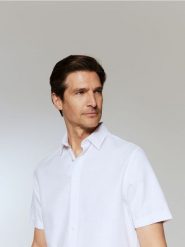 Elegancka koszula regular fit - biały. Białe koszule Reserved, l, bez wzorów, z bawełny, bez kołnierzyka, bez ramiączek. Za 99.99 zł.