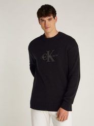 Calvin Klein Sweter w kolorze czarnym rozmiar: M. Czarne swetry nierozpinane CALVIN KLEIN, m, bez wzorów, bez kołnierzyka, bez ramiączek. Za 276.95 zł.