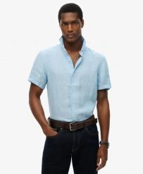 Superdry Koszula Vacation Linen krótki rękaw 100% len Sea Blue Chambray. Niebieskie koszule Superdry, na lato, s, bez wzorów, ze lnu, bez kołnierzyka, bez ramiączek. Za 322.70 zł.