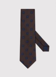 PAKO LORENTE – Brązowy krawat męski w kwadraty. Brązowe krawaty i muchy Pako Lorente, bez wzorów, z poliesteru. Za 99.99 zł.