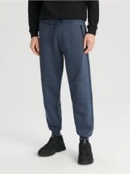 Spodnie dresowe jogger - niebieski. Niebieskie joggery i bojówki Sinsay, l, bez wzorów, z bawełny. Za 39.99 zł.