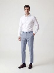 Garniturowe spodnie slim fit - jasnoniebieski. Niebieskie garnitury Reserved, bez wzorów, z tkaniny. Za 169.99 zł.