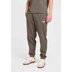 Spodnie do biegania Hummel Legacy 2.0. Niebieskie spodnie materiałowe Hummel, na co dzień, na lato, bez wzorów, z dresówki, sportowe. Za 269.50 zł.
