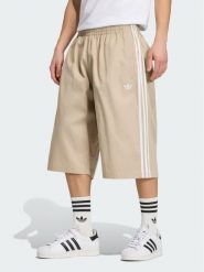 Adidas Szorty sportowe Adicolor Twill KR1388 Beżowy Relaxed Fit. Brązowe krótkie spodenki sportowe Adidas, l, bez wzorów, z bawełny. Za 279.99 zł.