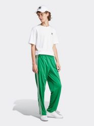 Adidas Spodnie dresowe w kolorze zielonym rozmiar: XXL. Zielone spodnie treningowe długie Adidas, xxl, bez wzorów, z dresówki. Za 200.45 zł.
