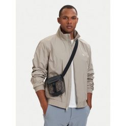 Saszetka Calvin Klein. Brązowe saszetki i nerki CALVIN KLEIN, bez wzorów, małe, bez dodatków. Za 329.99 zł.