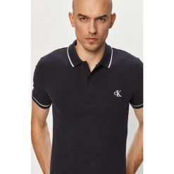Calvin Klein Jeans - Polo. Niebieskie koszulki polo Calvin Klein Jeans, l, bez wzorów, z jeansu, bez kołnierzyka, bez ramiączek. W wyprzedaży za 199.90 zł.