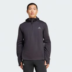 Bluza z kapturem Own The Run Winterized Hooded Half-Zip. Czarne bluzy Adidas, l, bez wzorów, z kapturem. Za 260.50 zł.