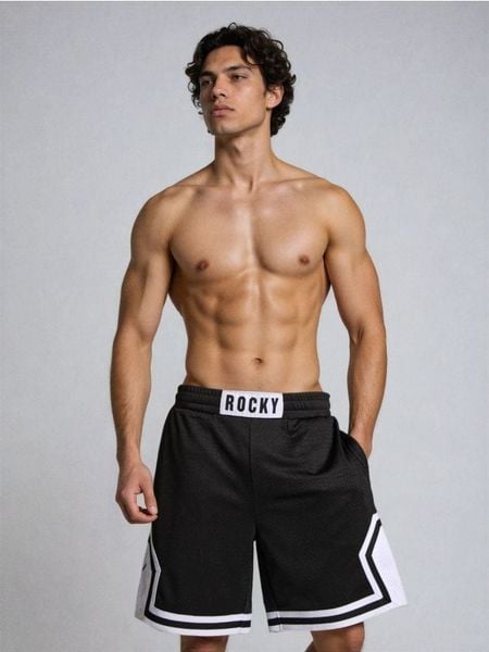 Szorty sportowe Rocky Balboa - czarny. Czarne krótkie spodenki sportowe Sinsay, l, bez wzorów. Za 49.99 zł.