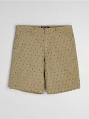 Szorty jeansowe chino - beżowy. Brązowe krótkie spodenki sportowe Sinsay, l, bez wzorów, z jeansu. W wyprzedaży za 35.99 zł.