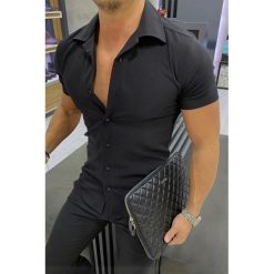 Męska koszula ARON BLACK. Czarne koszule Męska koszula ARON BLACK, l, bez wzorów, bez kołnierzyka, bez ramiączek. W wyprzedaży za 69.00 zł.