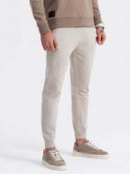 Spodnie męskie dresowe typu jogger - jasnobeżowe V1 OM-PABS-0173 - XXL. Brązowe joggery i bojówki Ombre Clothing, l, z aplikacjami, z bawełny. Za 65.99 zł.