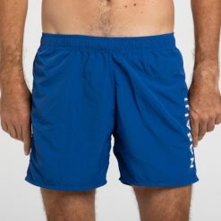 Szorty pływackie męskie Nabaiji 100 Basic. Niebieskie odzież kąpielowa NABAIJI, l, bez wzorów, z materiału, sportowe. Za 39.99 zł.