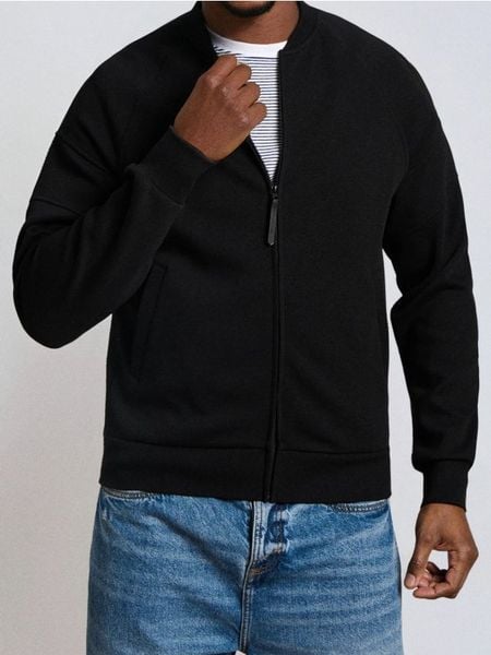Bluza bomber - czarny. Czarne bluzy bez kaptura Sinsay, l, bez wzorów, bez kaptura. W wyprzedaży za 33.99 zł.