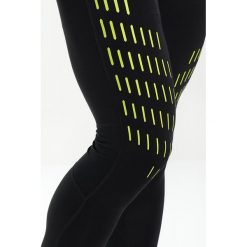 ODLO BOTTOM LONG OMNIUS Legginsy black/acid lime. Spodnie treningowe długie marki ODLO, z elastanu. Za 249.00 zł.