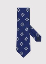 PAKO LORENTE – Granatowy krawat męski we wzór geometryczny. Niebieskie krawaty i muchy Pako Lorente, bez wzorów, z poliesteru. Za 99.99 zł.