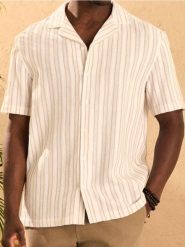 Luźna koszula w paski - kremowy. Białe koszule Sinsay, l, bez wzorów, bez kołnierzyka, bez ramiączek. Za 59.99 zł.