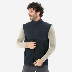 Kamizelka turystyczna męska polarowa Quechua MH500. Czarne odzież kompresyjna QUECHUA, l, bez wzorów, z elastanu, trekkingowe. Za 139.99 zł.
