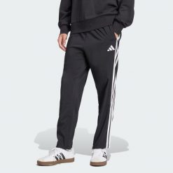 Spodnie Essentials 3-Stripes Stanford Open Hem. Białe spodnie treningowe długie Adidas, l, bez wzorów, z materiału. W wyprzedaży za 143.20 zł.