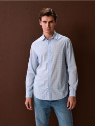 Koszula z długim rękawem we wzory - błękitny. Niebieskie koszule Sinsay, l, bez wzorów, bez kołnierzyka, bez ramiączek. Za 49.99 zł.