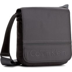 Saszetka CALVIN KLEIN - Matthew Reporter Wi K50K502894 009. Saszetki i nerki marki CALVIN KLEIN. W wyprzedaży za 229.00 zł.