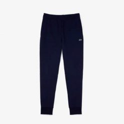 Spodnie Lacoste slim fit z organicznej bawełny granatowe. Niebieskie spodnie materiałowe LACOSTE, na co dzień, m, bez wzorów, z bawełny, sportowe. Za 510.65 zł.