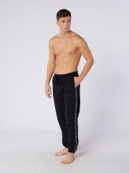 DKNY Spodnie dresowe w kolorze czarnym rozmiar: S. Czarne spodnie treningowe długie DKNY, s, bez wzorów, z bawełny. Za 88.64 zł.