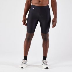 Legginsy do biegania krótkie męskie Kiprun Run 100. Czarne legginsy długie sportowe KALENJI, m, bez wzorów, z elastanu, do biegania. Za 49.99 zł.