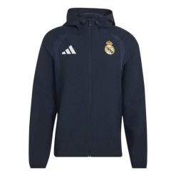 Kurtka przeciwwiatrowa z zamkiem Real Madrid Tiro 2026/27. Niebieskie kurtki Adidas, l, bez wzorów, ze splotem, bez kaptura. Za 388.00 zł.