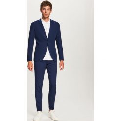 Spodnie garniturowe slim fit - Granatowy. Eleganckie spodnie Reserved. Za 149.99 zł.
