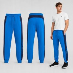 SPODNIE MĘSKIE DRESOWE 4F JOGGERY SPORTOWE NIEBIESKIE. Niebieskie joggery i bojówki 4F, m, bez wzorów, z bawełny, sportowe. Za 159.99 zł.