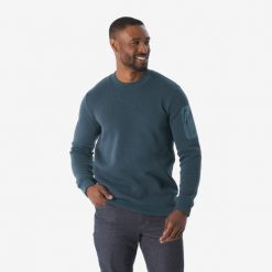 Sweter turystyczny męski Quechua NH100. Niebieskie swetry nierozpinane QUECHUA, m, bez wzorów, z bawełny, bez kołnierzyka, bez ramiączek. Za 89.99 zł.