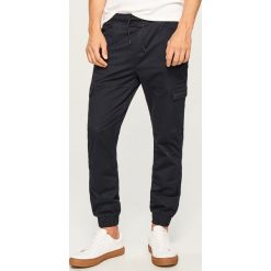 Spodnie jogger slim fit - Granatowy. Joggery i bojówki Reserved. Za 129.99 zł.