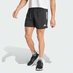Szorty Own The Run. Czarne szorty Adidas, s, bez wzorów, z materiału, sportowe. W wyprzedaży za 143.20 zł.